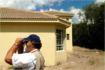Tony Steffer, a raptor expert, watching a nest in Tarpon Springs, Fla. Chip Litherland for The New York Times