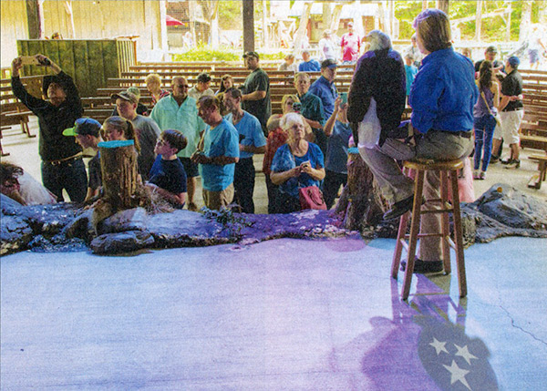 Karen Wilber holds an American bald eagle for the crowd to see up close.